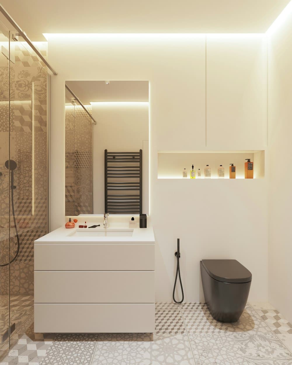 A modern bathroom: a stone basin on a floating vanity, a glazed shower, and a recessed shelf holding a few bottles.